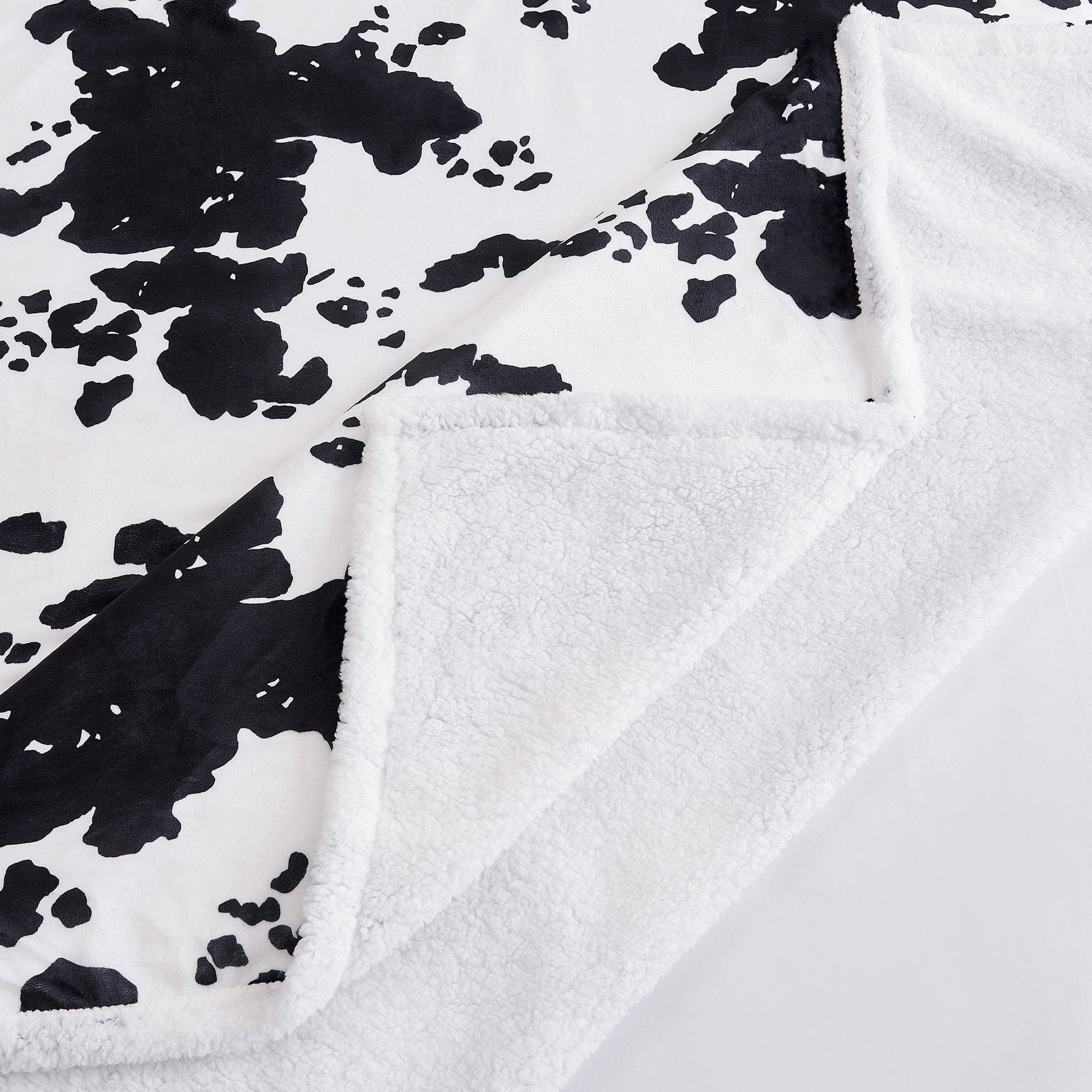 Elsa Cowhide Campfire Sherpa Throw